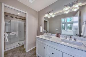 a bathroom with two sinks and a large mirror at Tahoe Retreat on the Meadow- Hot Tub AC in South Lake Tahoe +41 photos