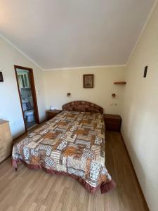 a bedroom with a large bed in a room at Stas Apartments in Đenovići