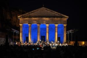 a concert in front of a building with blue lights at Corfu Villa Poulos in Astrakeri +3 photos