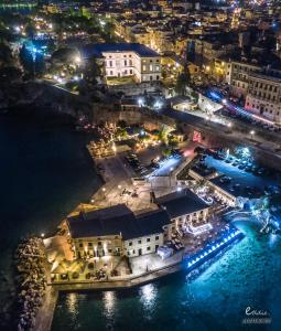 an aerial view of a city at night at Corfu Villa Poulos in Astrakeri