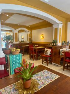 a living room with a table and chairs at Pension Casa Austria in Calella