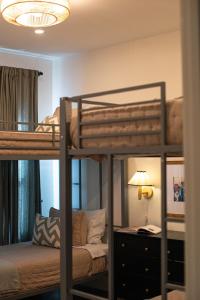 a bedroom with two bunk beds and a lamp at Orion B, Vaulted Ceilings, Pool, Bunk Room in Port Isabel +97 photos