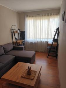 a living room with a couch and a coffee table at 2 precu 17 in Daugavpils