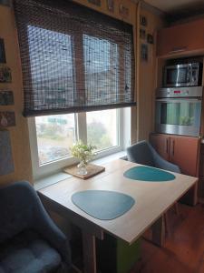 a kitchen with a wooden table with blue circles on it at 2 precu 17 in Daugavpils