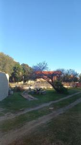 a park with a picnic table in the grass at Hostería Amancay in Merlo