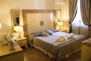 a bedroom with a bed with two dogs laying on it at Villa dei Tigli 920 Liberty Resort in Rodigo +4 photos
