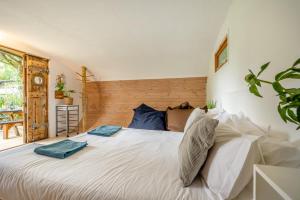 a bedroom with a large white bed with pillows at 1 Bed in Bude oc-s34881 in Bude