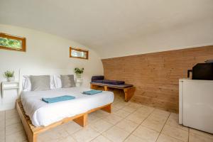 a bedroom with a large white bed and a television at 1 Bed in Bude oc-s34881 in Bude