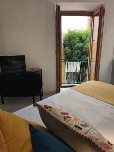 a bedroom with a bed and a view of a balcony at fairytale home - panorama in Agropoli