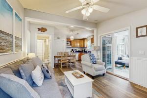a living room with a couch and a table at Selkie Village in Wells