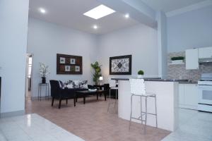 a kitchen and living room with a table and chairs at New York view 37 in West New York +7 photos