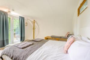 a bedroom with a bed and a window at 1 Bed in Bude oc-s34858 in Bude