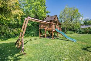 a playground with a slide in the grass at 1 Bed in Bude oc-s34858 in Bude +15 photos