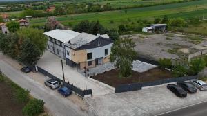 an aerial view of a house with a parking lot at DION Hotel & Restaurant in Kumanovo