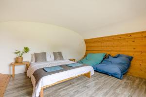 a bedroom with a bed and two blue pillows at 1 Bed in Bude oc-s34853 in Bude
