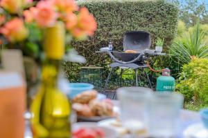 a barbecue grill sitting on a table with food at 1 Bed in Bude oc-s34853 in Bude