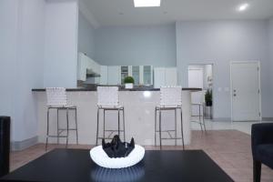 a living room with a table with a bowl on it at New York view 38 in West New York +8 photos
