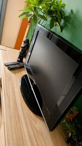 a laptop computer sitting on top of a table at Appartement thème jungle in Avallon +13 photos