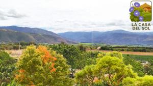 a view of a valley with mountains and trees at Casa del Sol Tumbabiro in Tumbabiro
