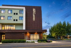 a building with a sign on the side of it at Courtyard by Marriott Eugene Downtown in Eugene