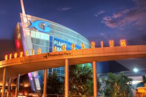 a large building with a sign on top of it at Just like home in Atlanta