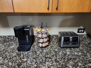 a kitchen counter with a toaster and a toaster and cupcakes at Just like home in Atlanta +12 photos