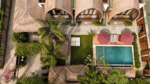 an aerial view of a house with a swimming pool at Martas Windows in Kuta Lombok