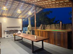 a ping pong table in the middle of a patio at Chalé Átina - Atins in Atins