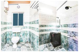 a bathroom with a toilet and tiled walls at Super Hotel O Jessore Road Kolkata Formerly Skyline Serenity in Kolkata