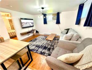 a living room with a couch and a table at The Extravagant Minimalist in Gatineau