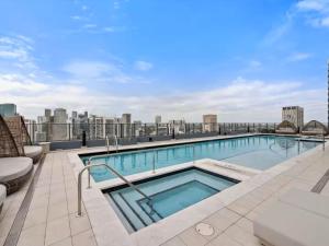 a swimming pool on the roof of a building at Miami Skyline Escape in Miami