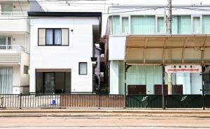 a building on the side of a street at Dream Tree 札幌市电步行0分钟 超市步行1分钟 in Sapporo