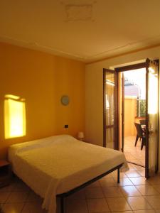 Katil atau katil-katil dalam bilik di Locanda Del Centro