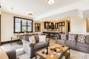 a living room with a couch and a table at Tranquil Blackstone Getaway in Park City