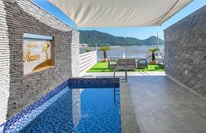 a swimming pool in the side of a house at Raum Resort 1 in Suncheon