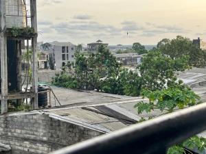 a view of a city from the roof of a building at Hôtel Famigni in Douala