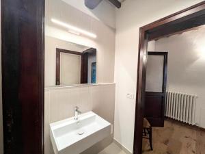 a bathroom with a sink and a mirror at Apartment Stele, Pesaro in Pesaro +24 photos
