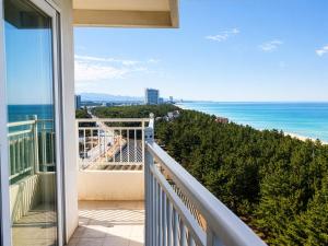 a balcony with a view of the ocean at Gangneung Top Ocean in Gangneung