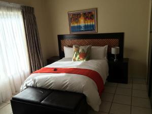 Una cama o camas en una habitación de Mcbest Guest House