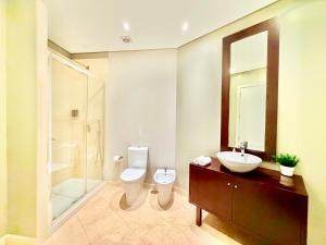 a bathroom with a toilet and a sink and a shower at Lisboa Arroios Apartment in Lisbon +29 photos