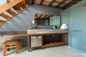 a bathroom with a sink and a mirror at Rock Bay by Chành Rành in Vĩnh Hy