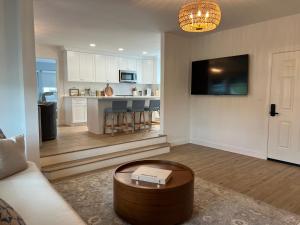 a living room with a couch and a coffee table at Oceana By The Sea in Point Pleasant Beach
