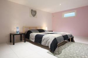 Postel nebo postele na pokoji v ubytování La Maison Tourangelle