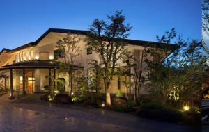 a large white house with trees in front of it at REKADO ROOM Shinsuizenji 3C in Kumamoto