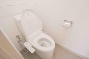a bathroom with a white toilet with a remote control at REKADO ROOM Shinsuizenji 3C in Kumamoto +45 photos