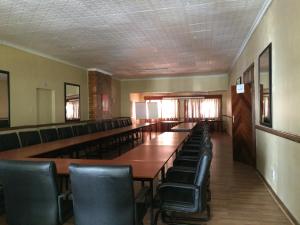 El área de trabajo o centro de convenciones de Mcbest Guest House