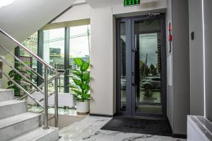 an entrance to a building with a glass door at Singala Hotel Ulaanbaatar in Ulaanbaatar