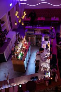 an overhead view of a store with a man preparing food at Siglo Hotel by Keahotels in Siglufjörður