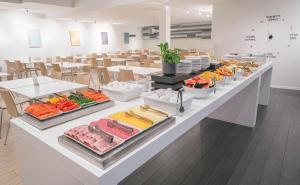 a buffet line with different types of food on display at Reykjavik Lights Hotel by Keahotels in Reykjavík