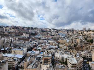 an aerial view of a city with buildings at Citadel Boutique Hotel in Amman